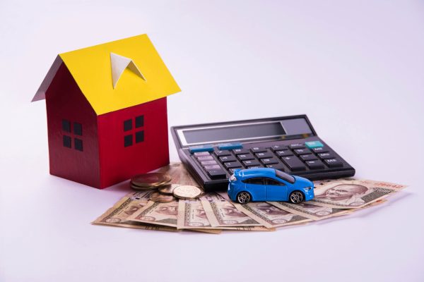 Auto Finance and Housing Loan or purchase in India -  Concept showing 3D Car and house model, keys, indian currency notes and calculator etc